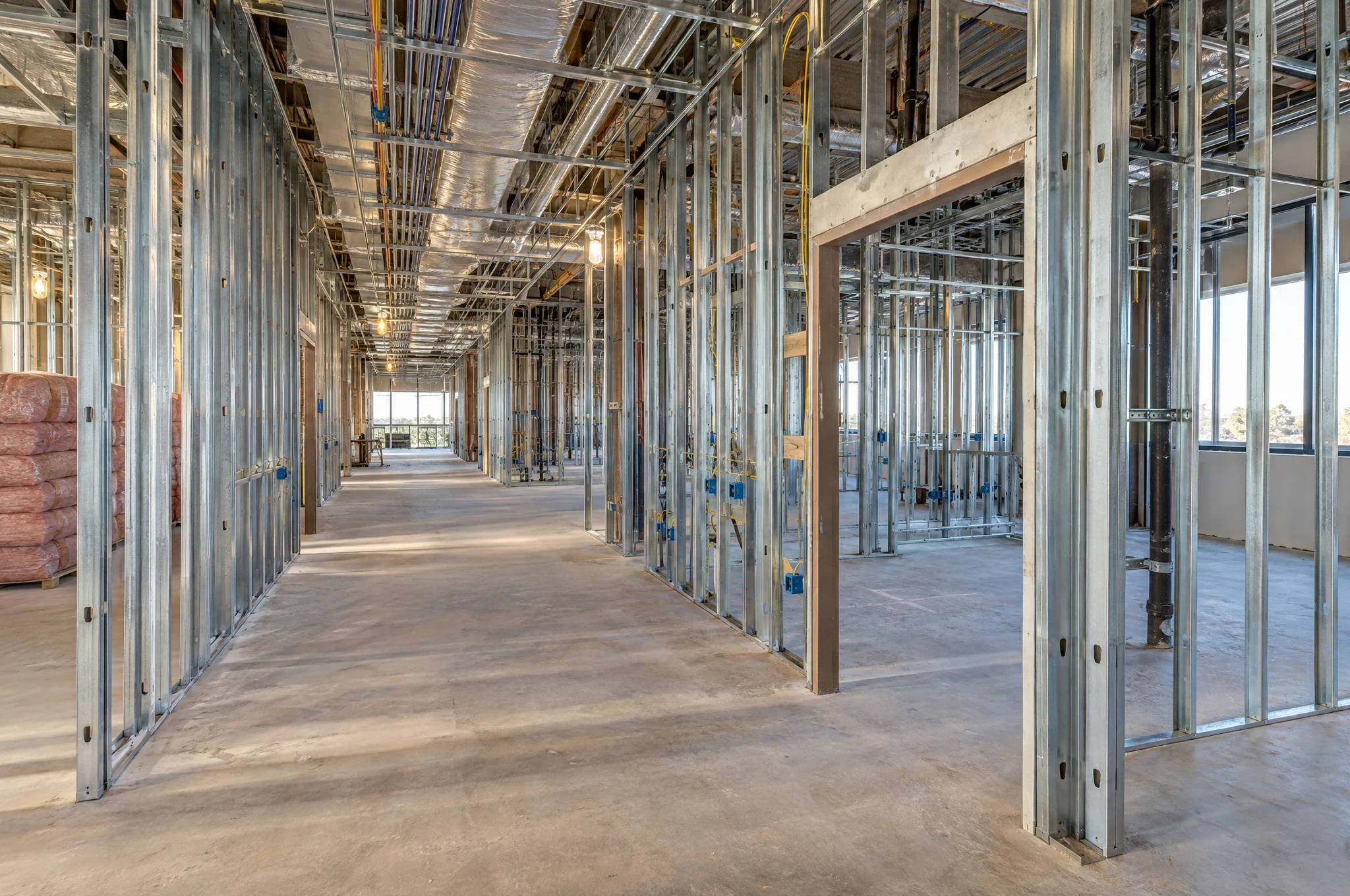 Metal framing and exposed building systems before drywall installation