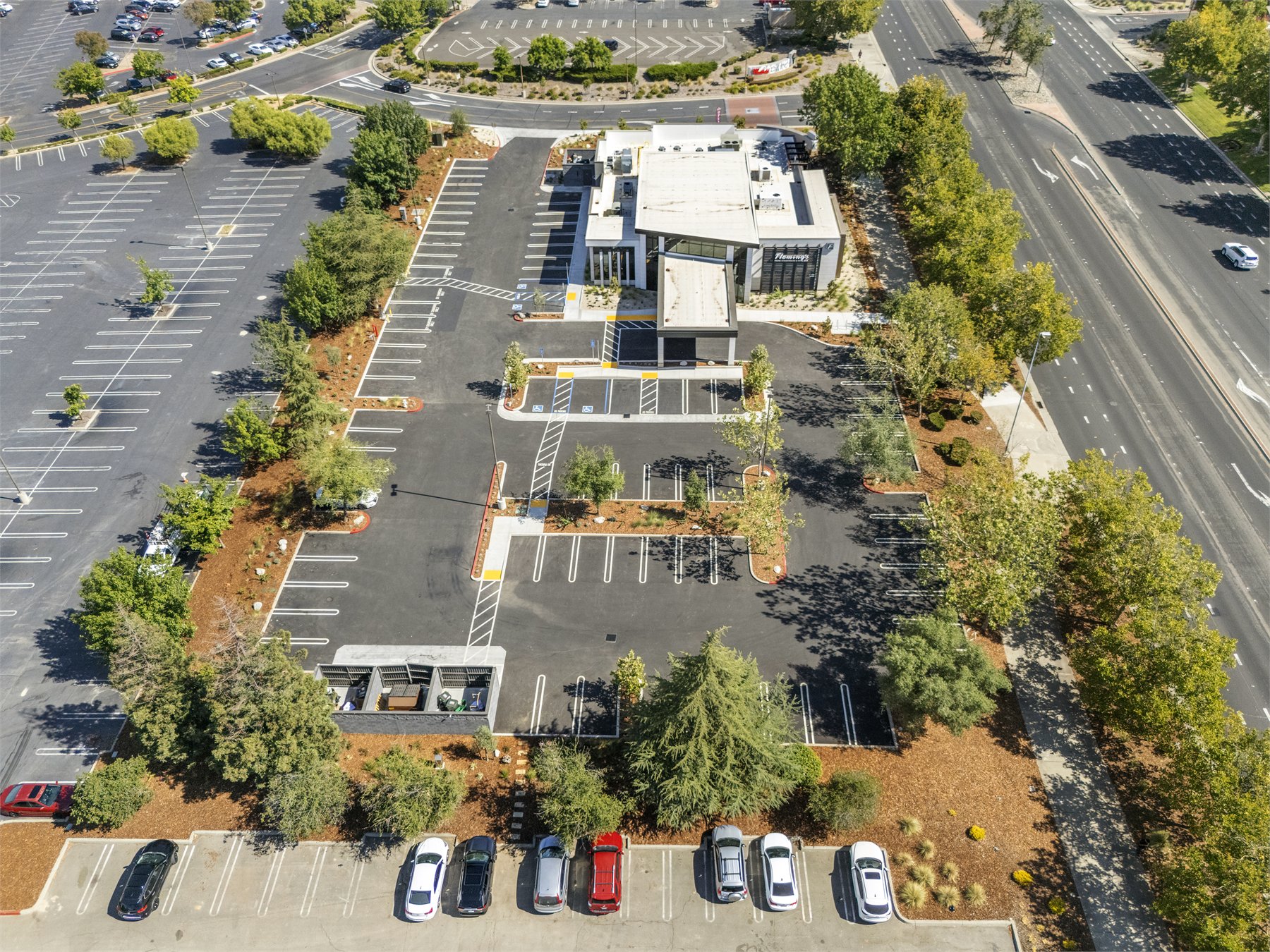 Top-down commercial aerial view showing parking and building layout