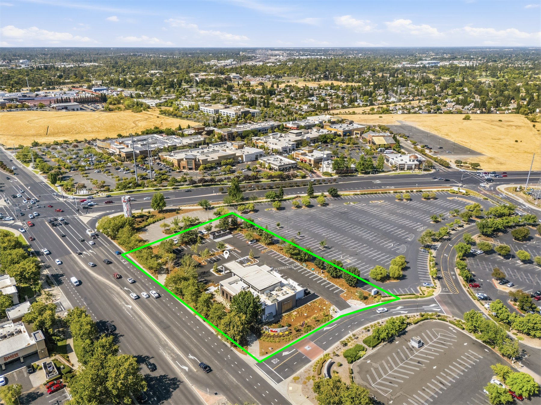 Commercial aerial view showing surrounding uses and access
