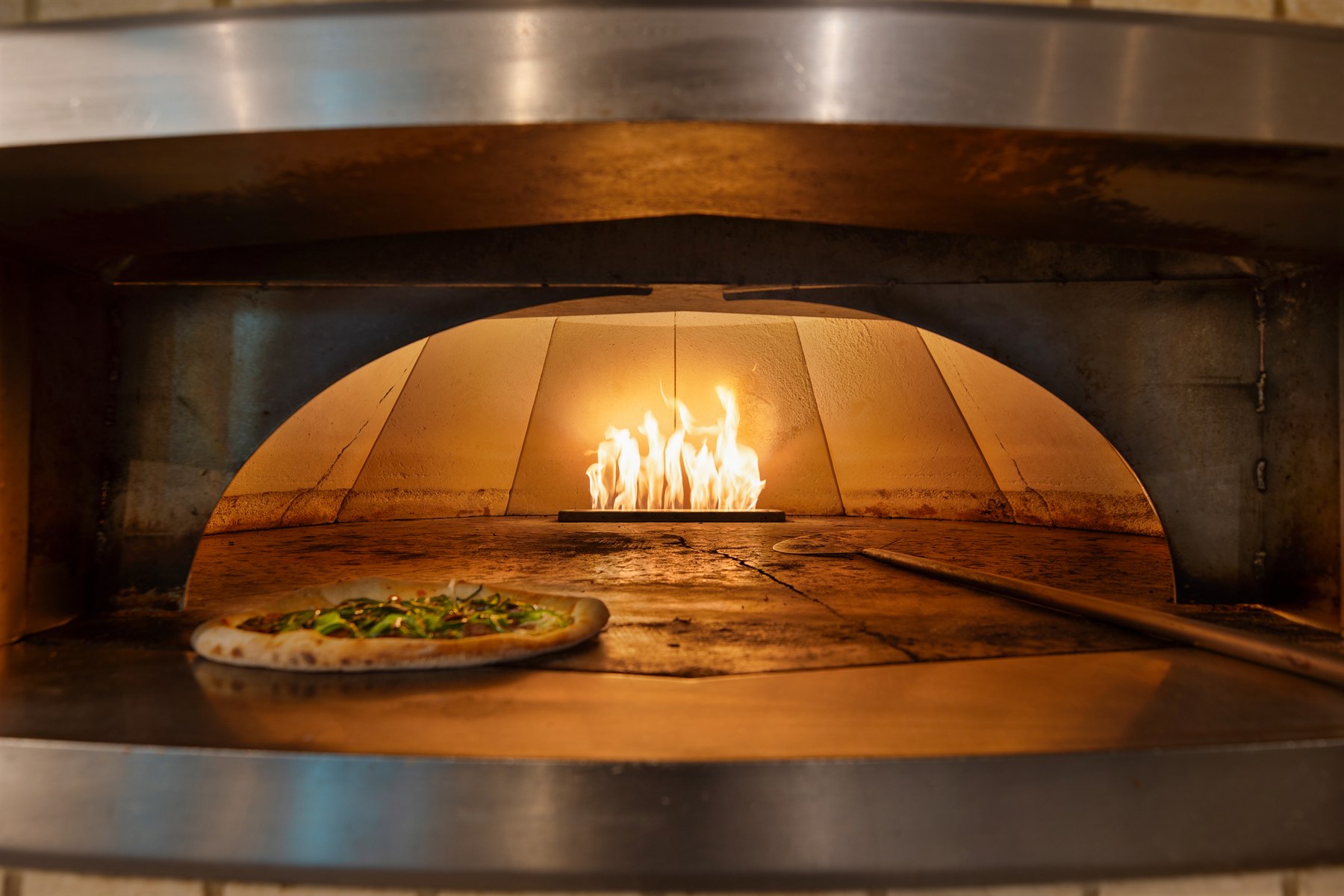 Hospitality oven detail photographed for atmosphere and food service storytelling