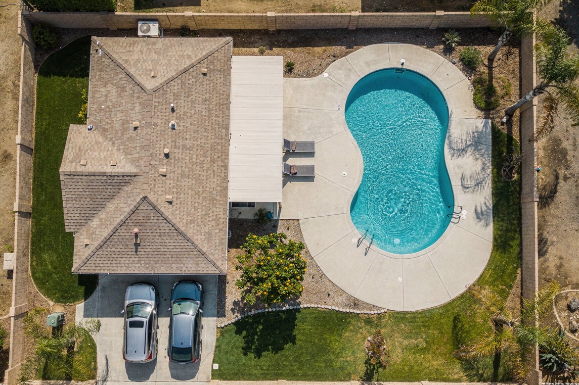 Top-down residential aerial view showing pool and yard layout