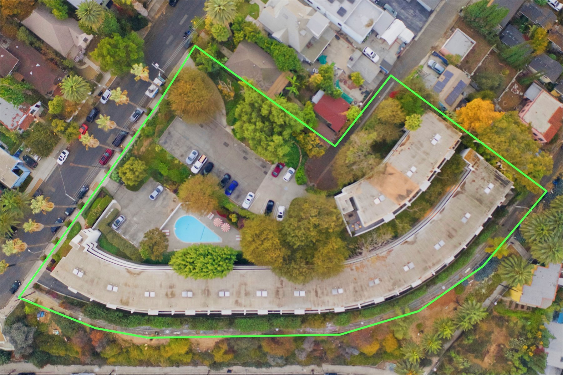 Drone view showing residential lot and neighborhood context
