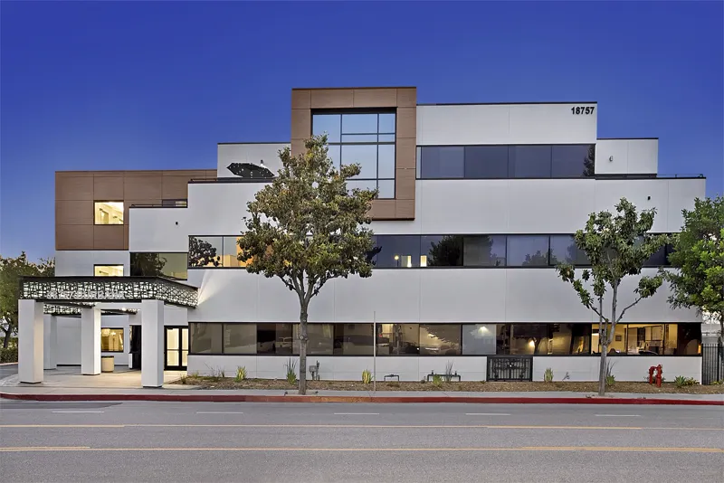 Commercial office facade photographed at blue hour
