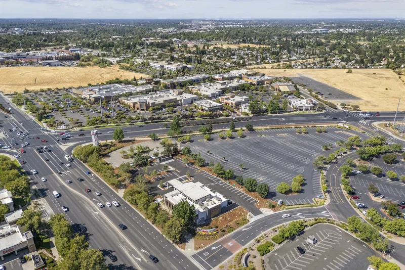 Hospitality aerial view showing rooftop and surrounding context