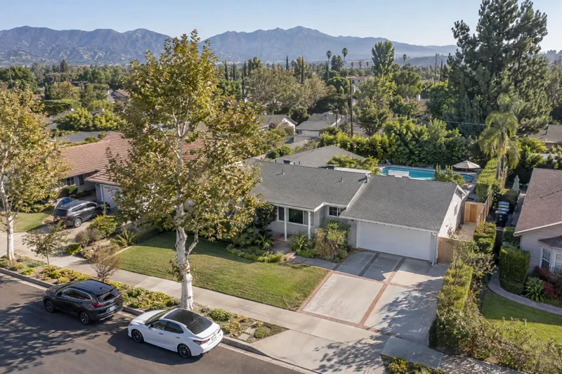 Daytime residential drone photo: valley ranch