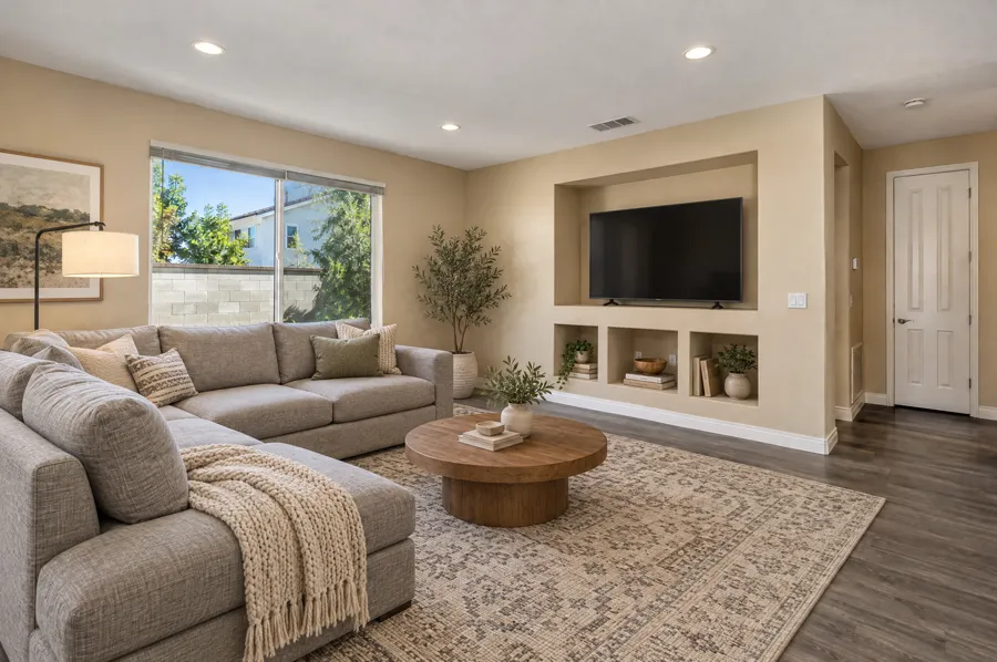 Family Room virtually staged in a cozy sectional setup style