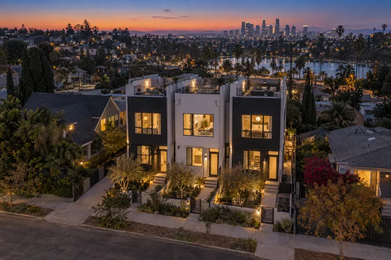 Small-Lot Townhomes home photographed at twilight from an aerial drone angle