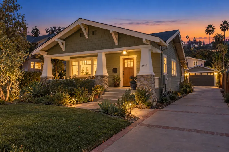 Craftsman Bungalow home photographed at twilight from a ground-level angle