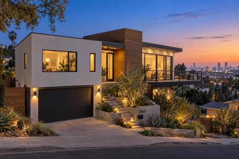 Hillside Modern home photographed at twilight from a ground-level angle