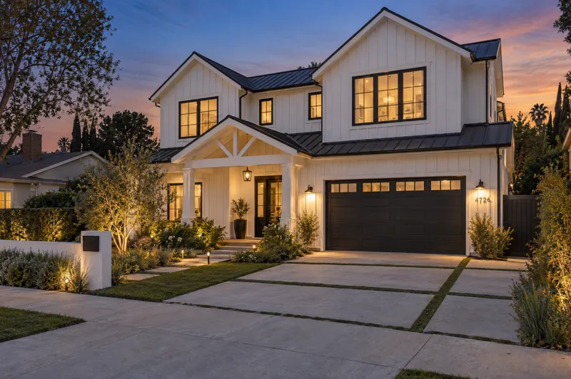 Modern Farmhouse home photographed at twilight from a ground-level angle